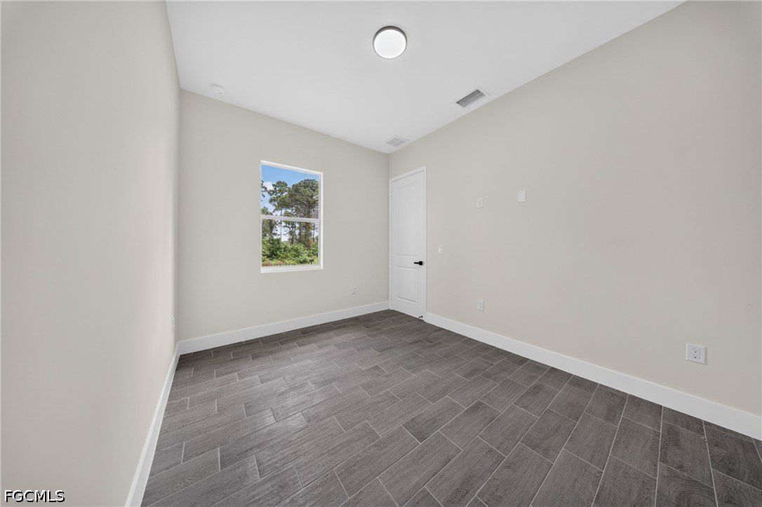 308 Mangonia Avenue. Lehigh Acres, FL 33974