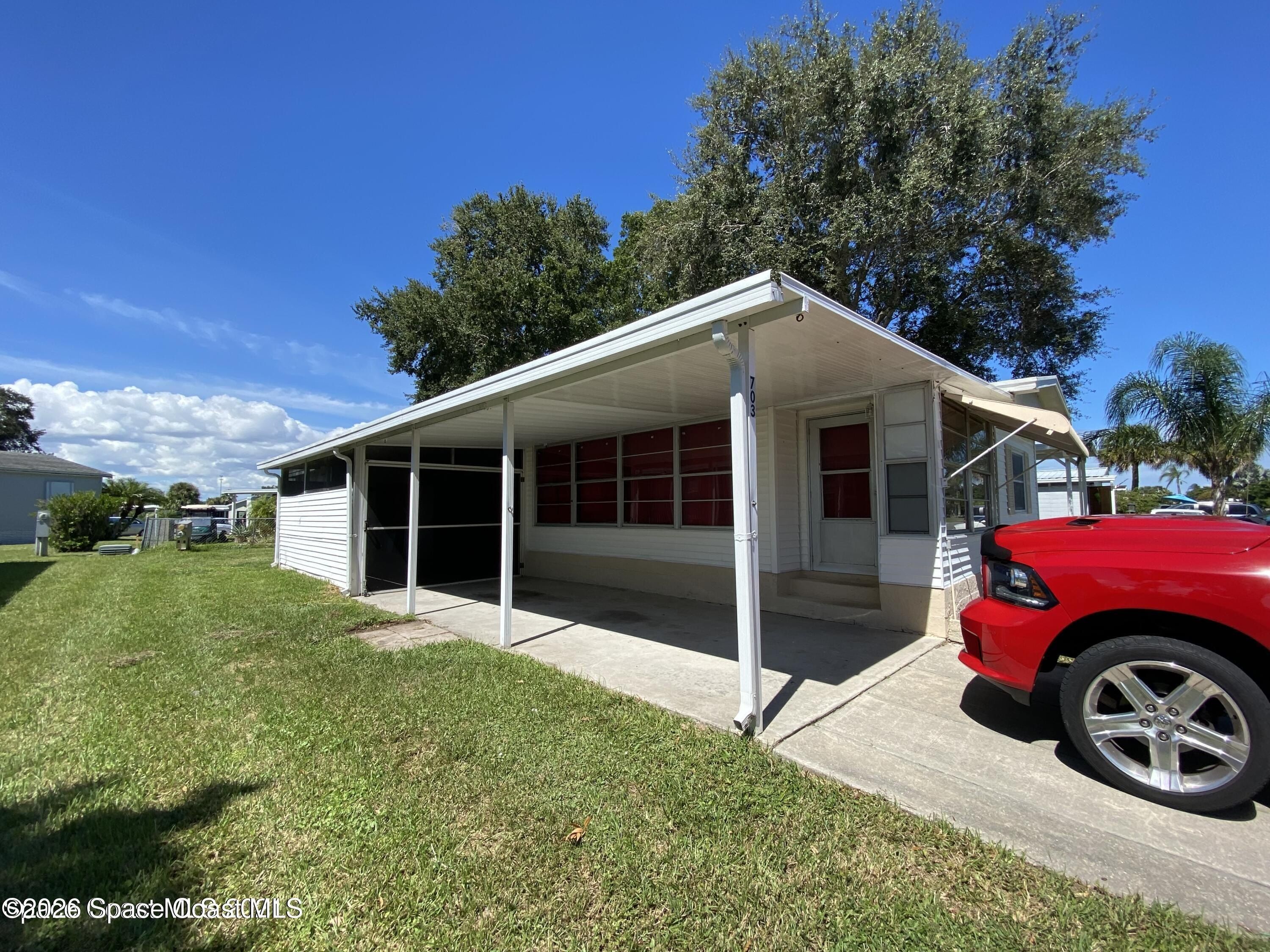 703 Lark Drive. Barefoot Bay, FL 32976