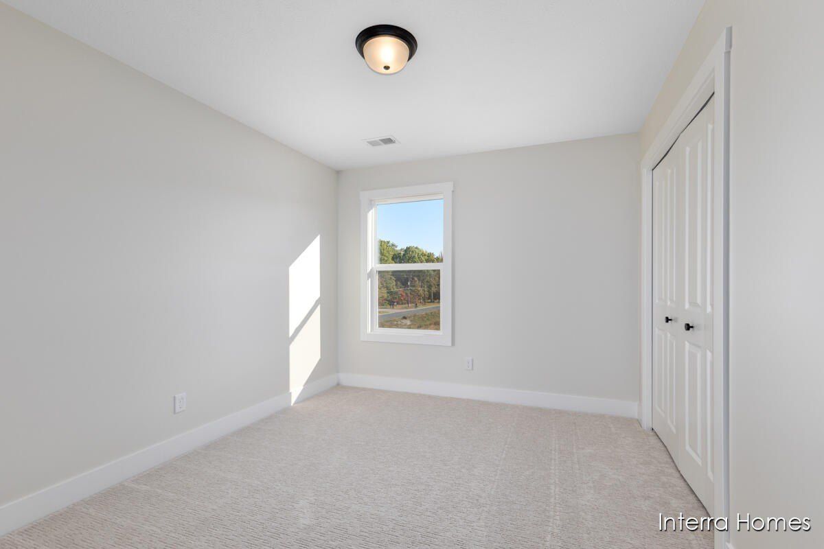 6138 Burgess Drive. Spring Lake, MI 49456