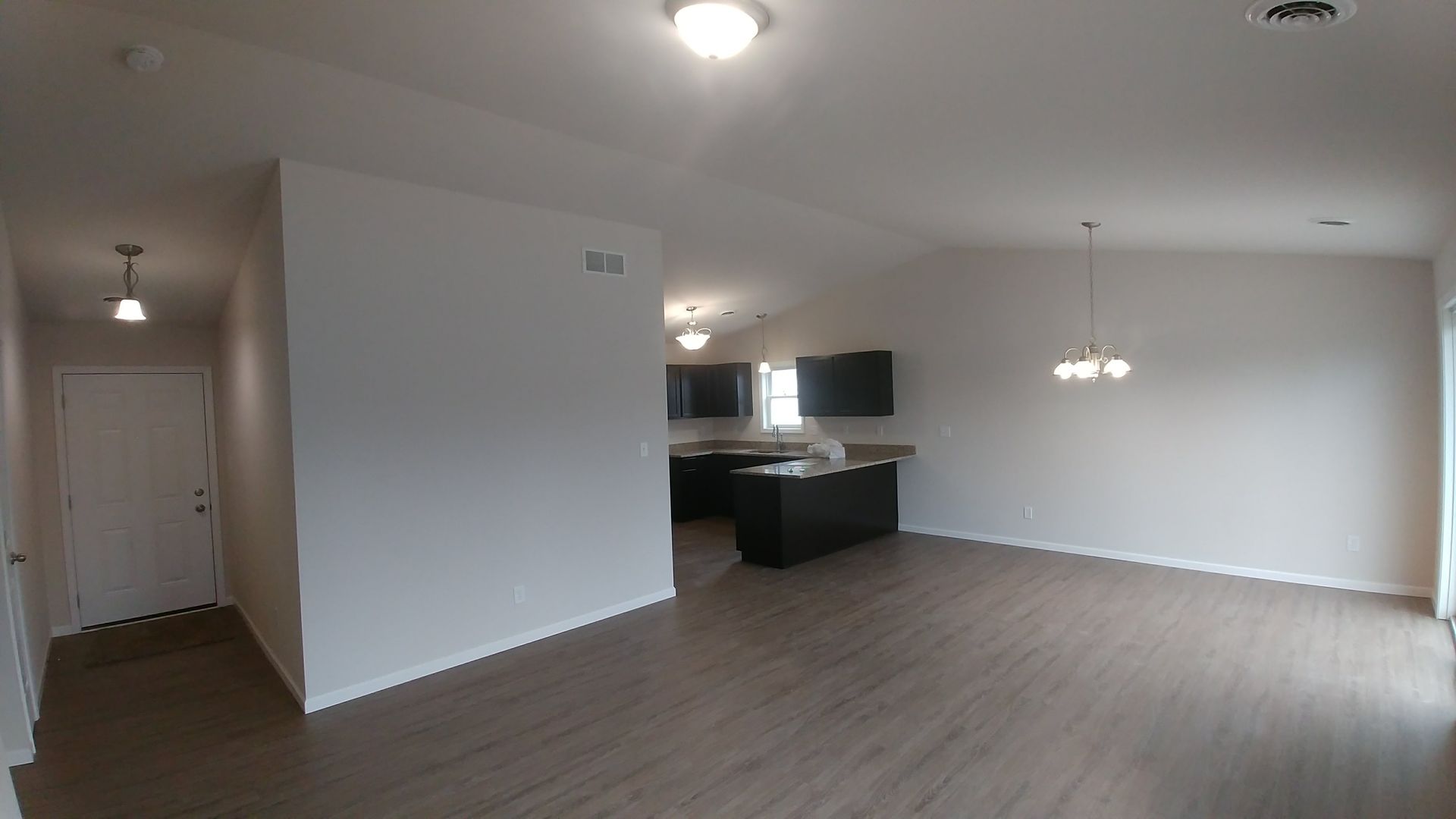 Great room, entry & kitchen from living room area
