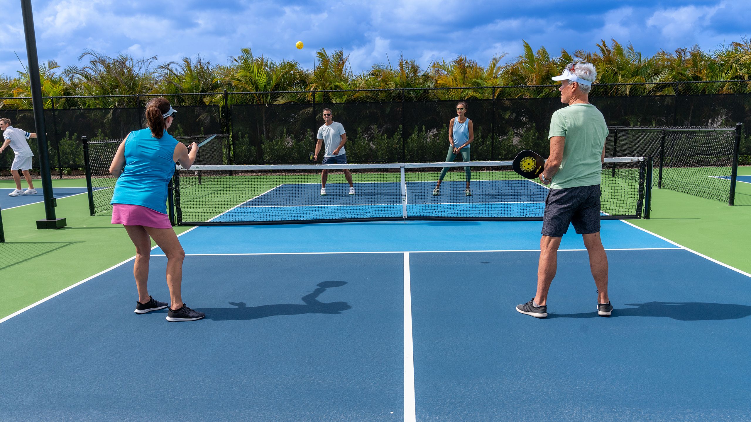 Serving up a game of pickleball at one of the many courts in Avenir