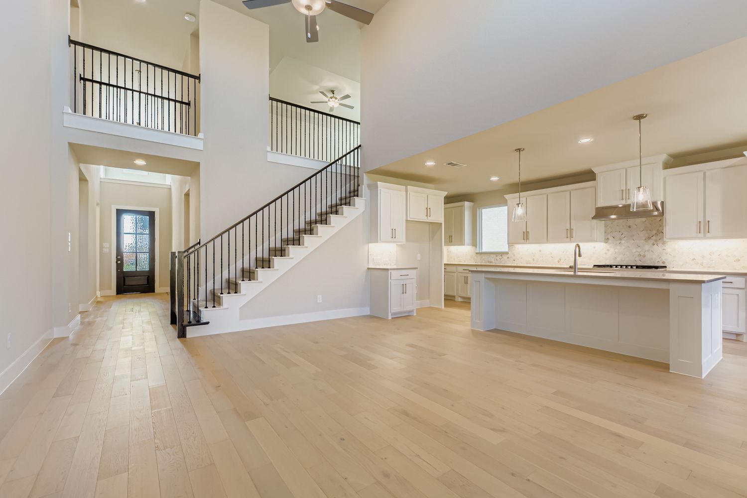 Plan 1579 - Representative Photo - Staircase/Entry/Kitchen
