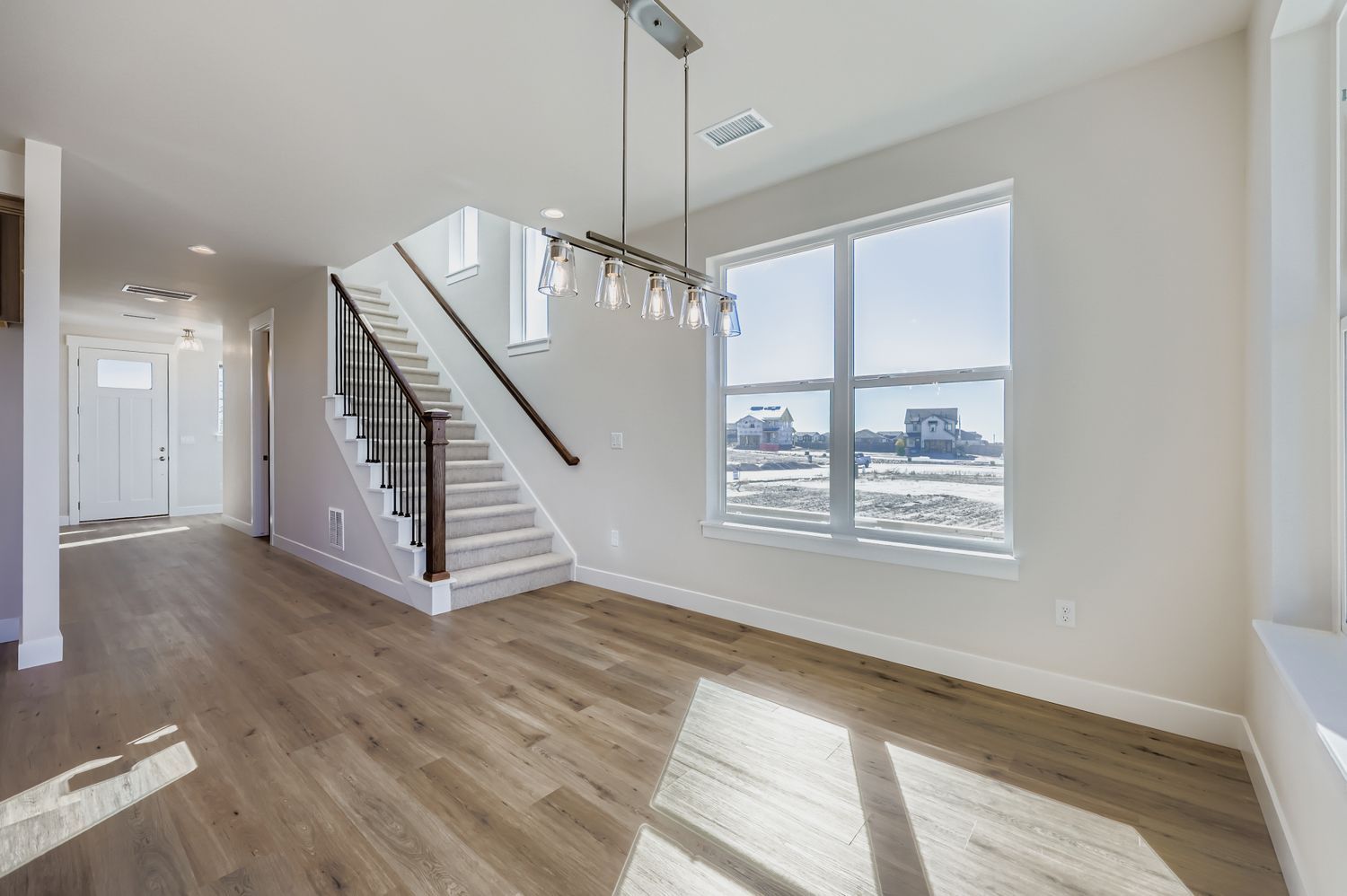 Representative photo of Plan C303 dining area/entry/staircase
