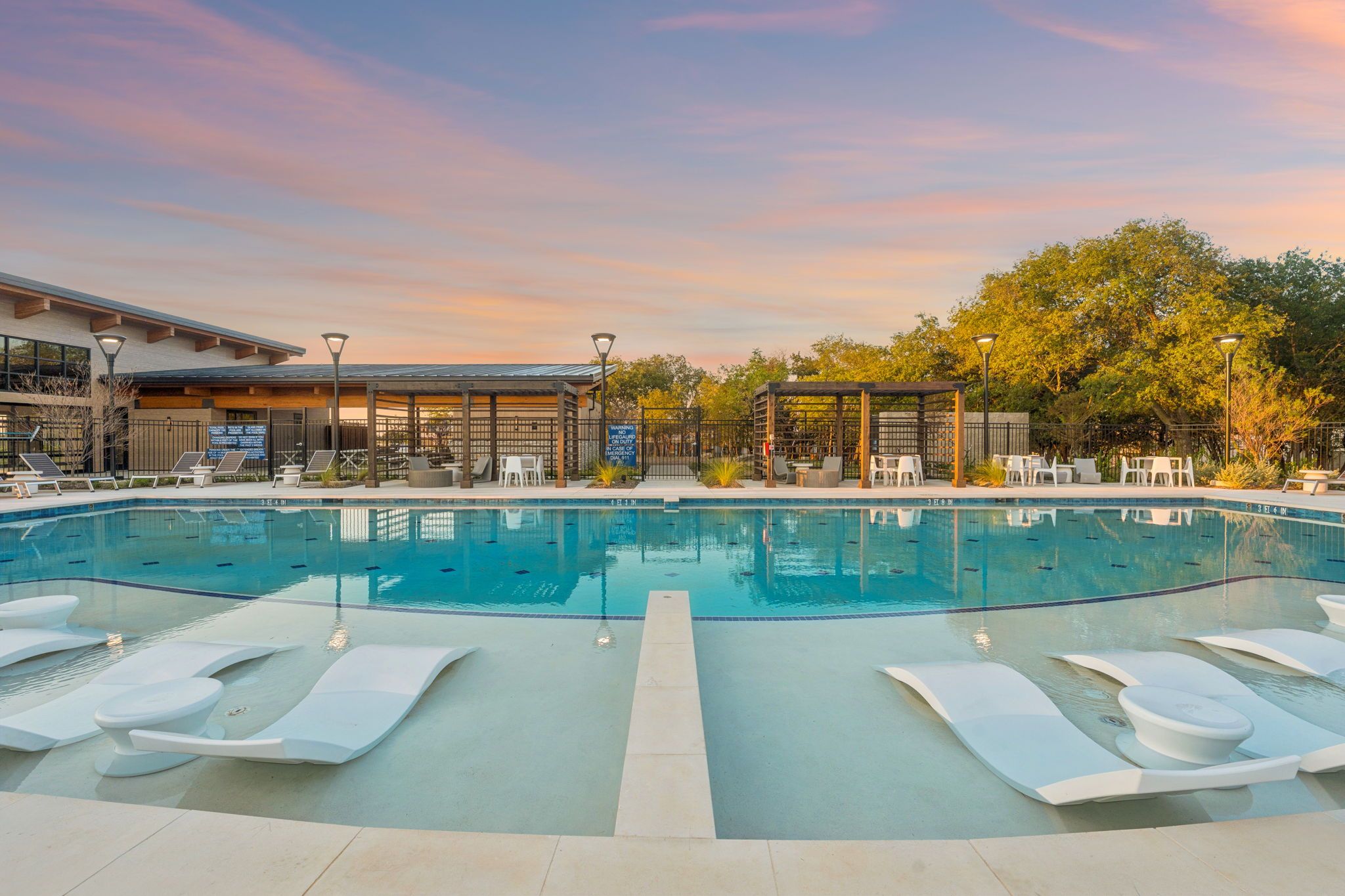 Wildridge Rudman Sunset Photo of Community Pool and Cabanas