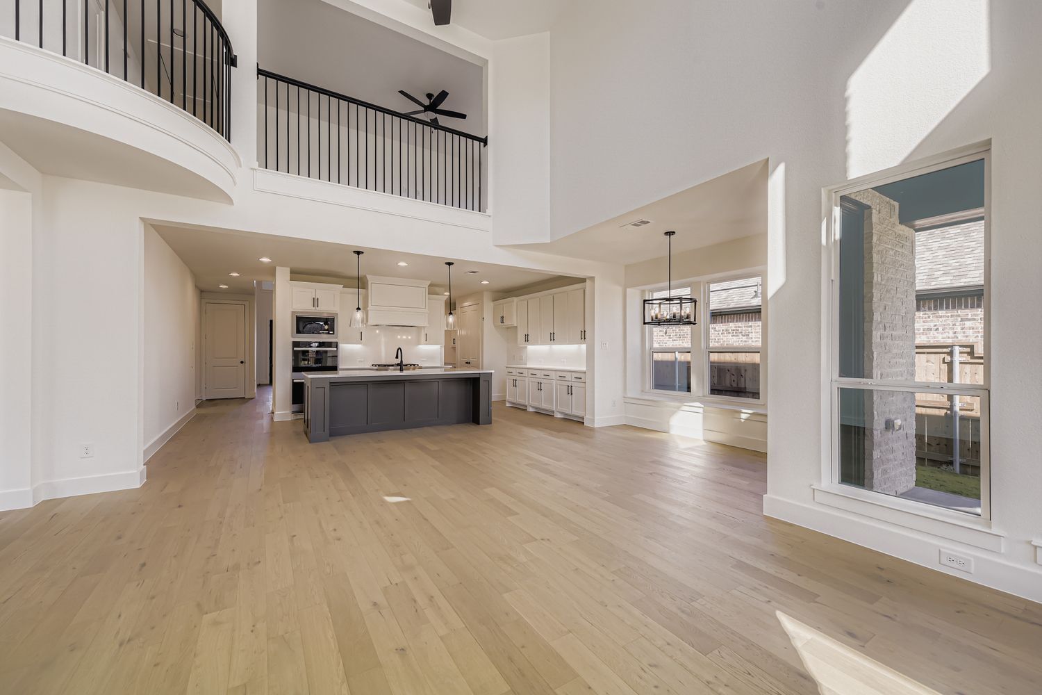 Plan 1536 representative photo of the living room/kitchen/dining area