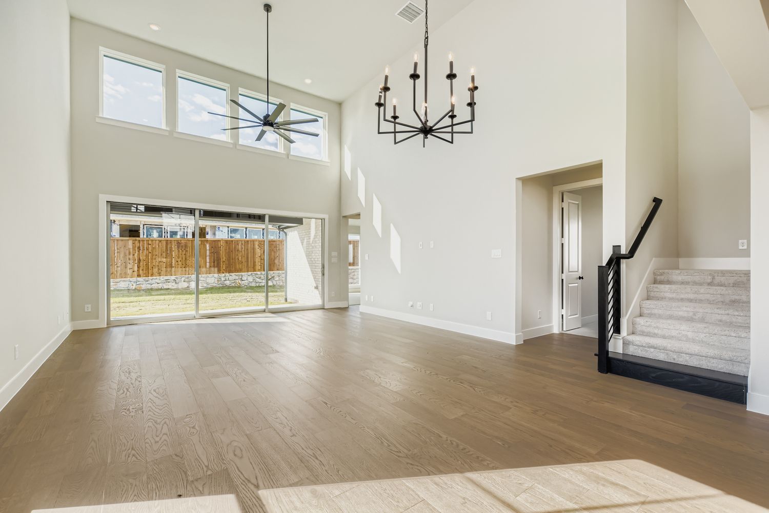 Open-Concept Living Room with Soaring Ceilings | Plan 1581 | Representative Photo