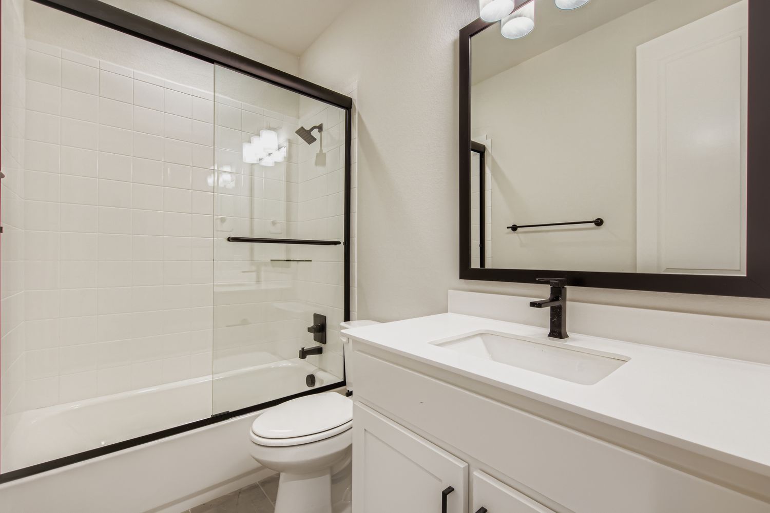 Secondary Bathroom with Modern Fixtures| Plan 1581 | Representative Photo