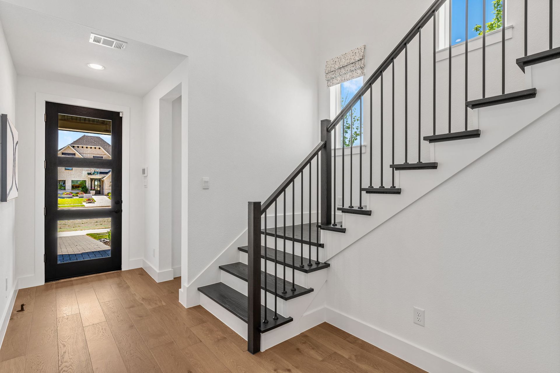 Entry Staircase in 40’ Model Home at Mosaic Celina