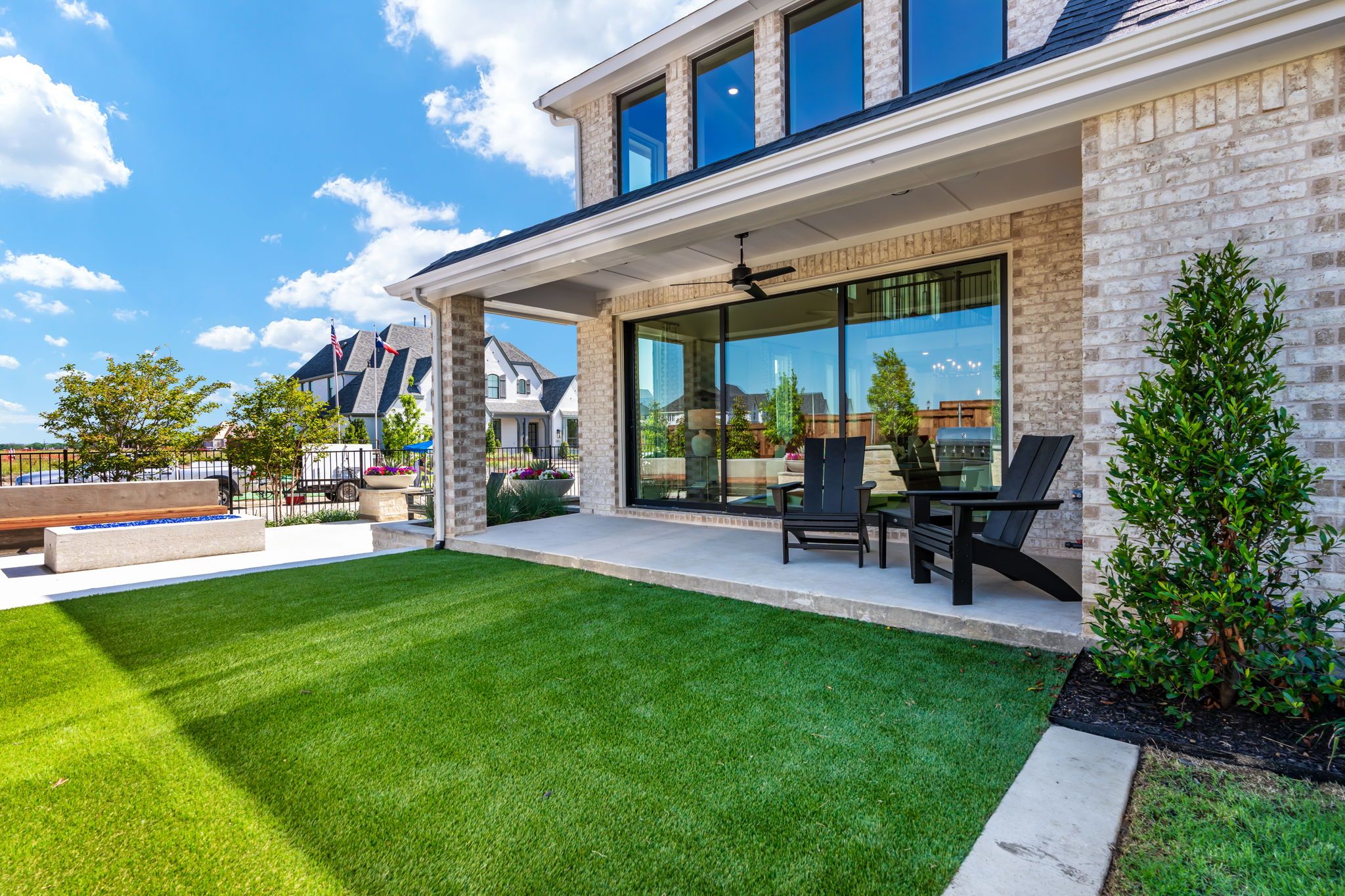 Backyard Lawn and Patio Seating Area – Mosaic Celina 50' Model