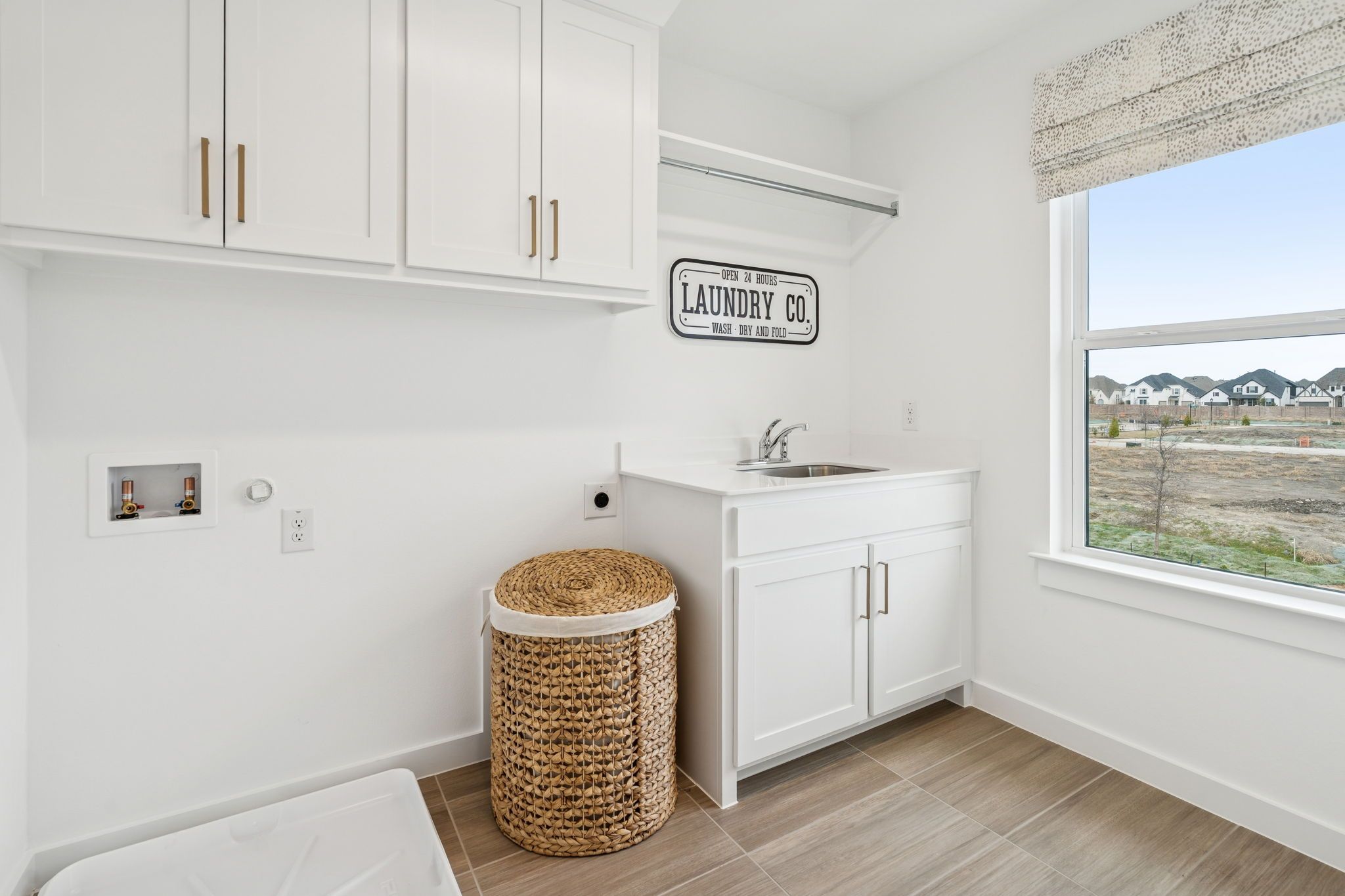 Functional Laundry Room with Storage – Mustang Lakes Celina