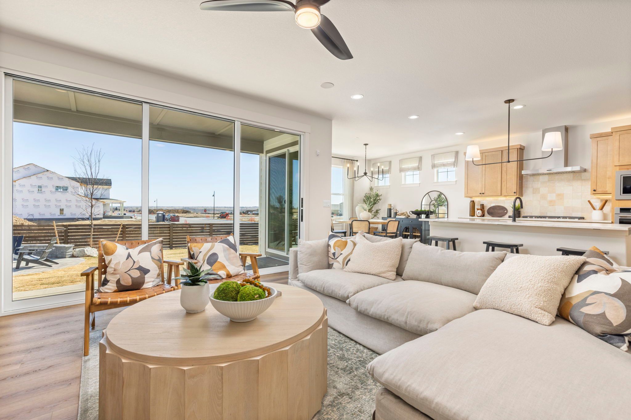 Modern Great Room with Fireplace and Sliding Glass Doors | Barefoot Villages Firestone CO