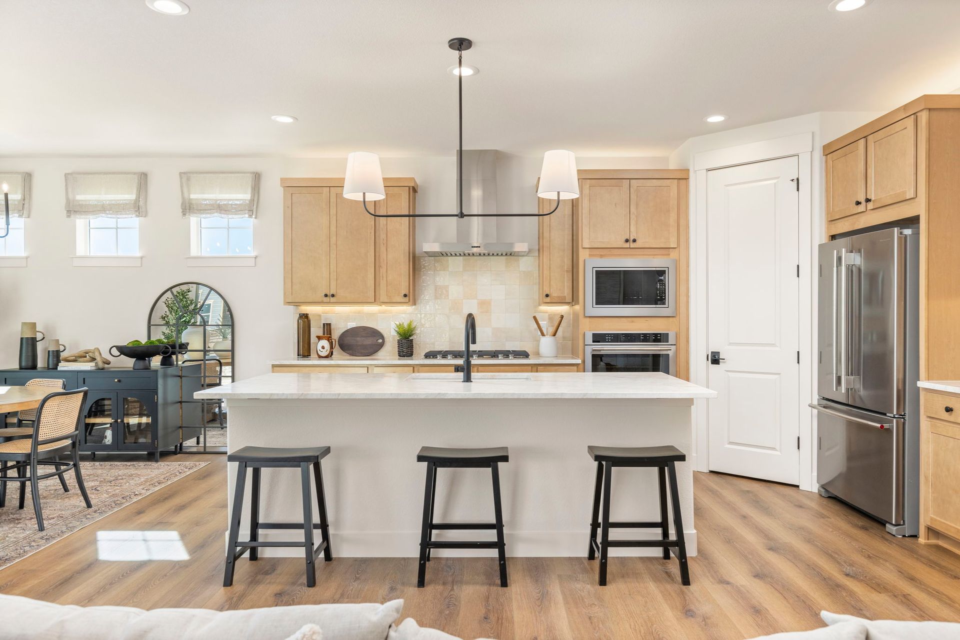 Modern Kitchen with Large Island and Wood Cabinets | Barefoot Lakes Firestone CO