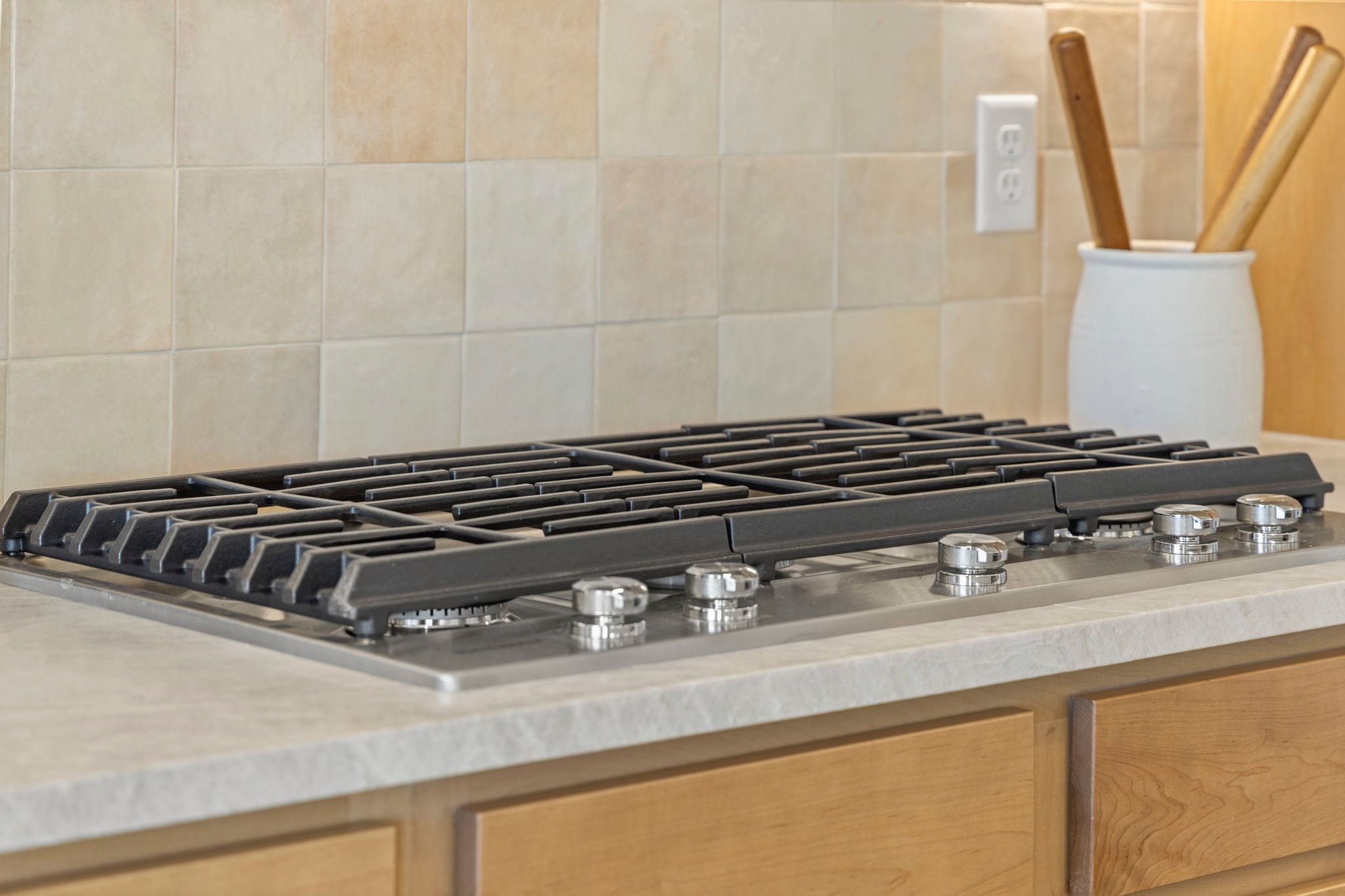 Chef-Style Gas Cooktop with Stone Countertops | Barefoot Villages Kitchen