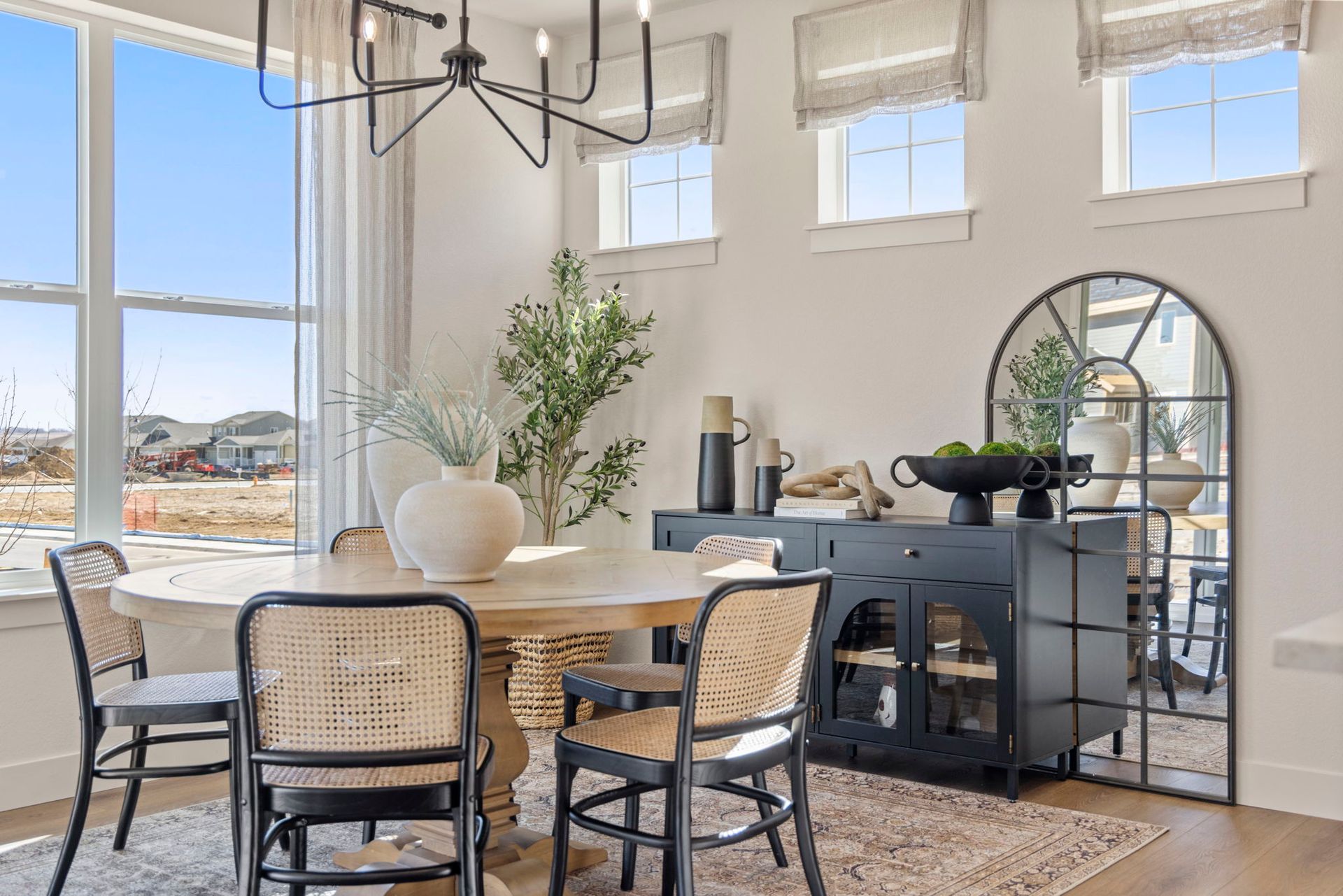 Bright Dining Space with Designer Chandelier | Barefoot Villages Home Firestone