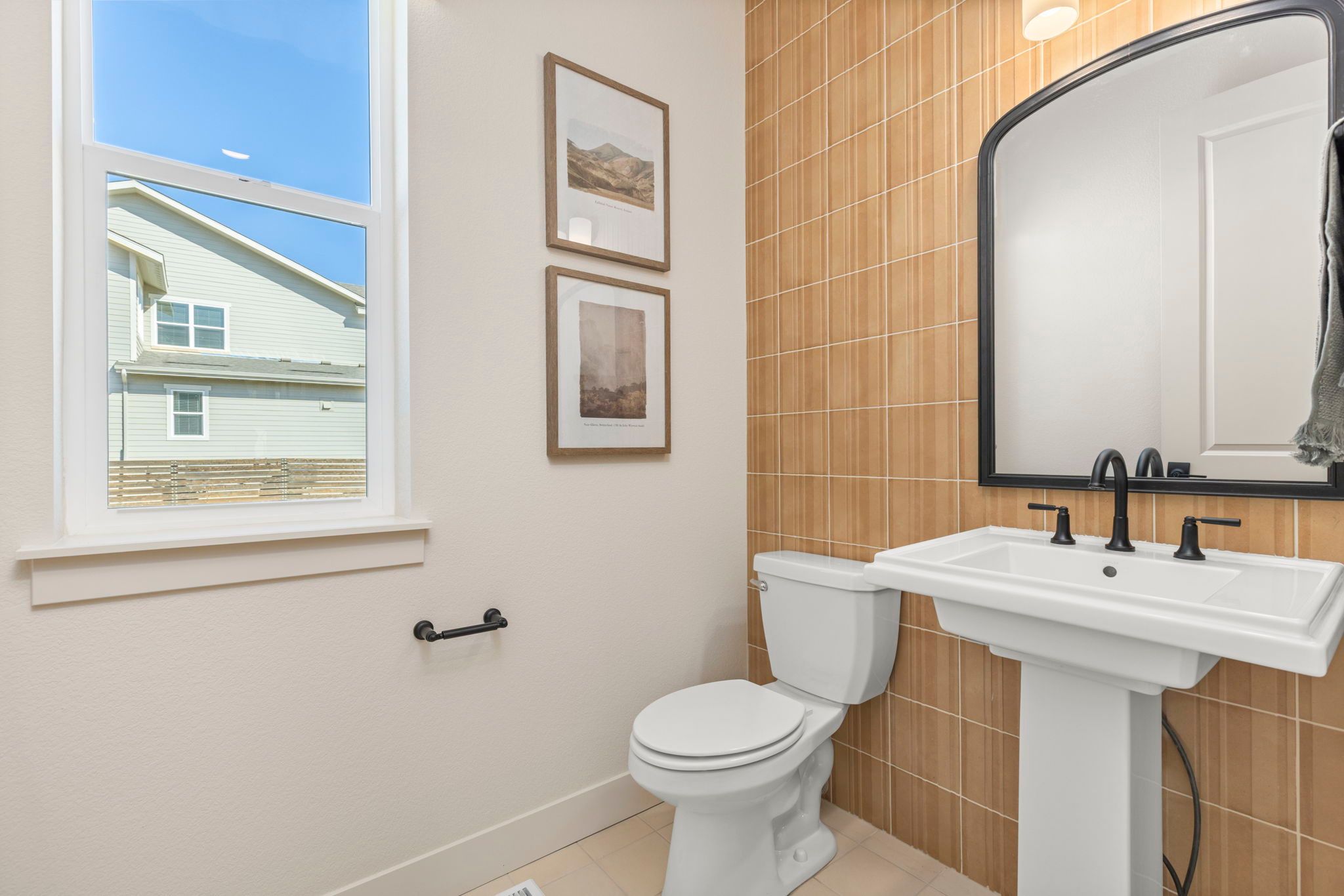 Modern Powder Bathroom with Vertical Tile Accent Wall | Barefoot Villages Firestone