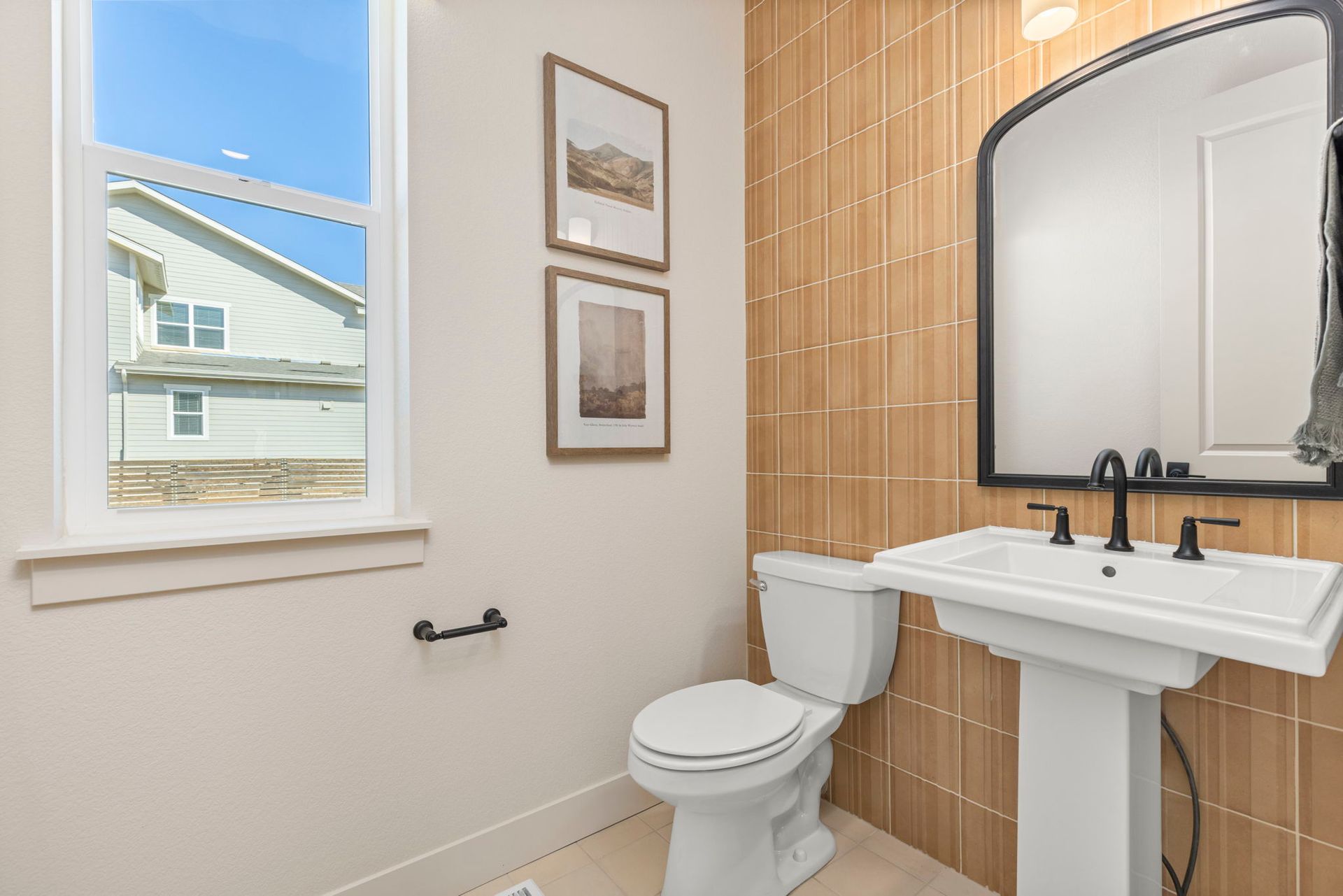 Modern Powder Bathroom with Vertical Tile Accent Wall | Barefoot Villages Firestone
