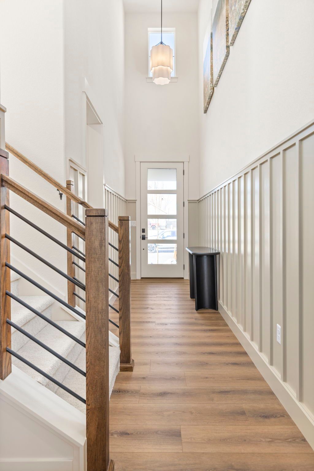 Two-Story Entryway with Staircase and Modern Lighting | Barefoot Lakes Firestone CO