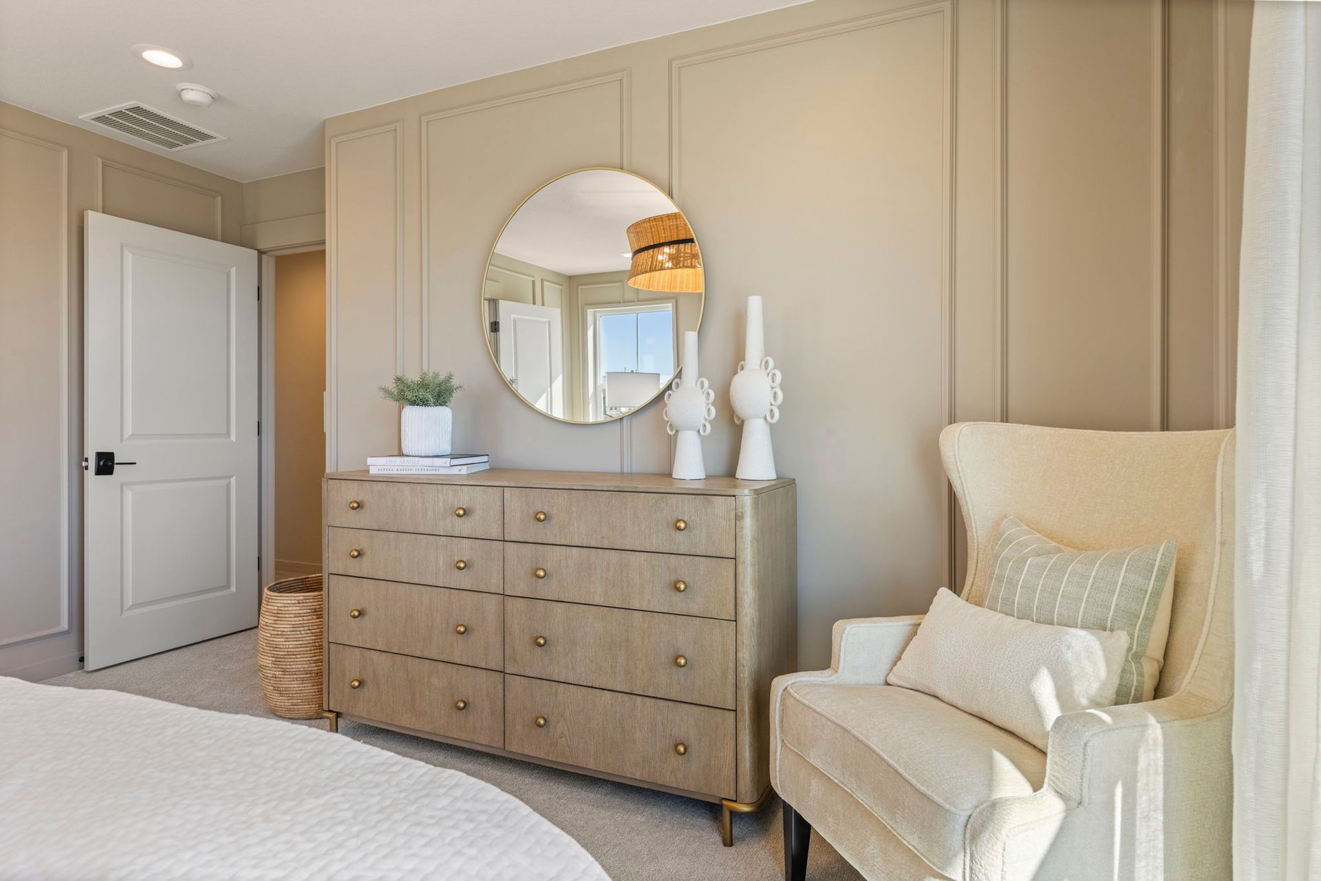 Primary Bedroom with Accent Chair and Dresser | Barefoot Villages Firestone
