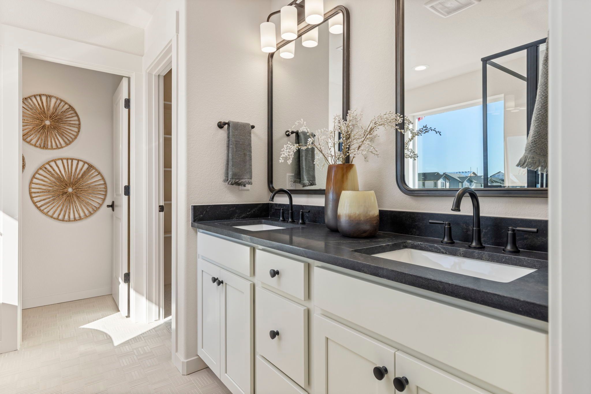 Dual Vanity Bathroom with Modern Fixtures | Barefoot Villages Firestone CO