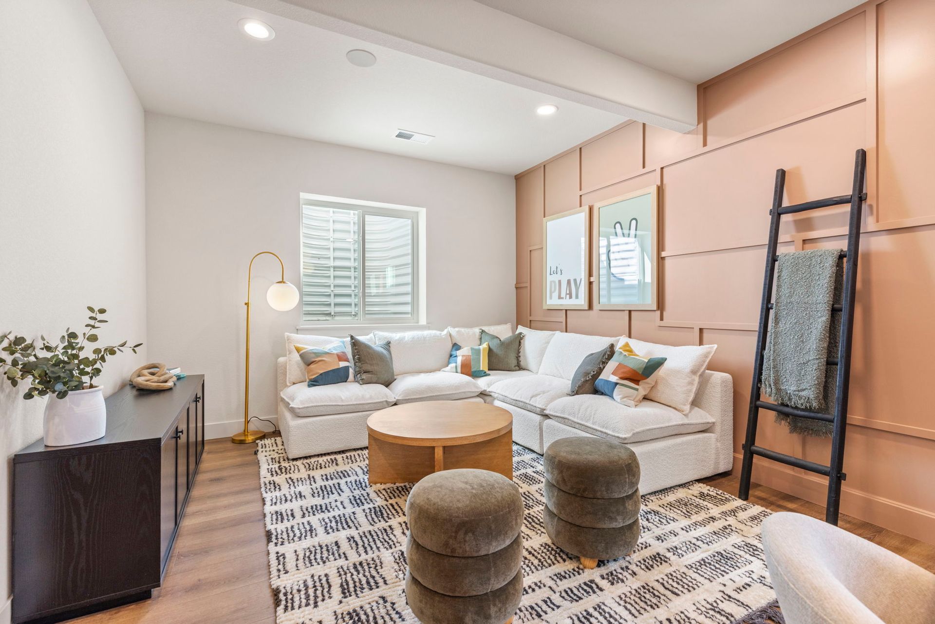Cozy Lounge with Sectional Seating and Accent Wall | Barefoot Villages