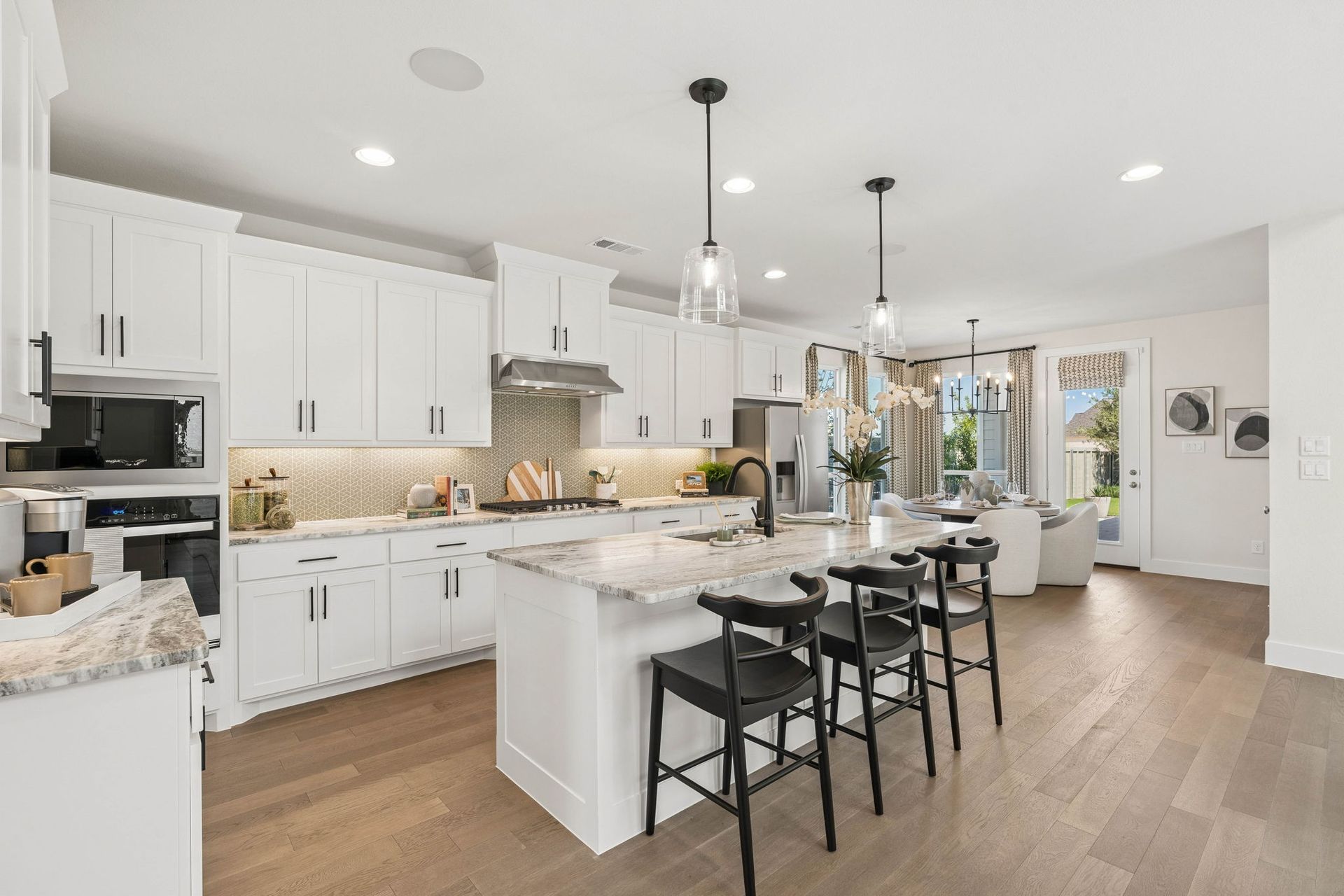 Spacious Kitchen with Island Seating and Dining Space - Representative Photo Plan 1462