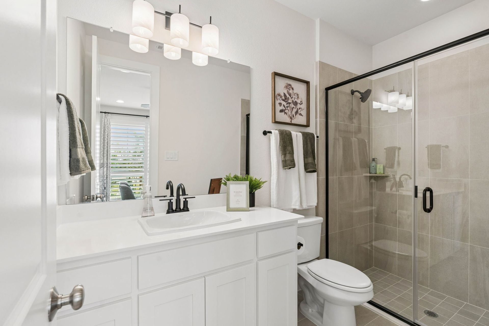 Stylish Secondary Bathroom in American Legend Homes Model Home