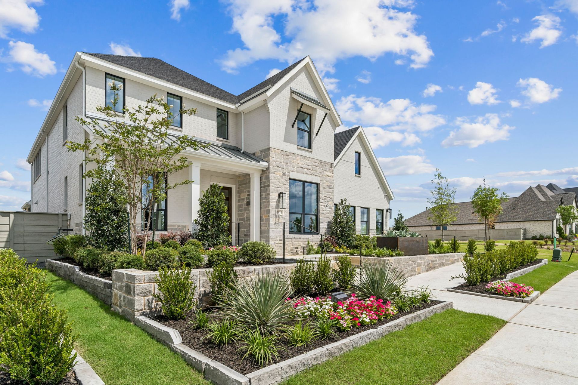 Professionally Landscaped Model Home with Exceptional Curb Appeal