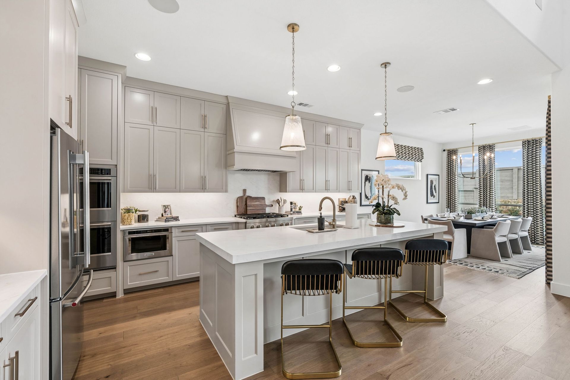 Designer Kitchen with Oversized Island and Casual Dining