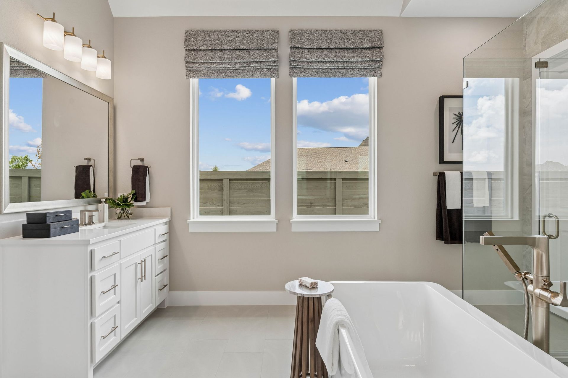 Bright Luxury Bath with Freestanding Tub and Natural Light