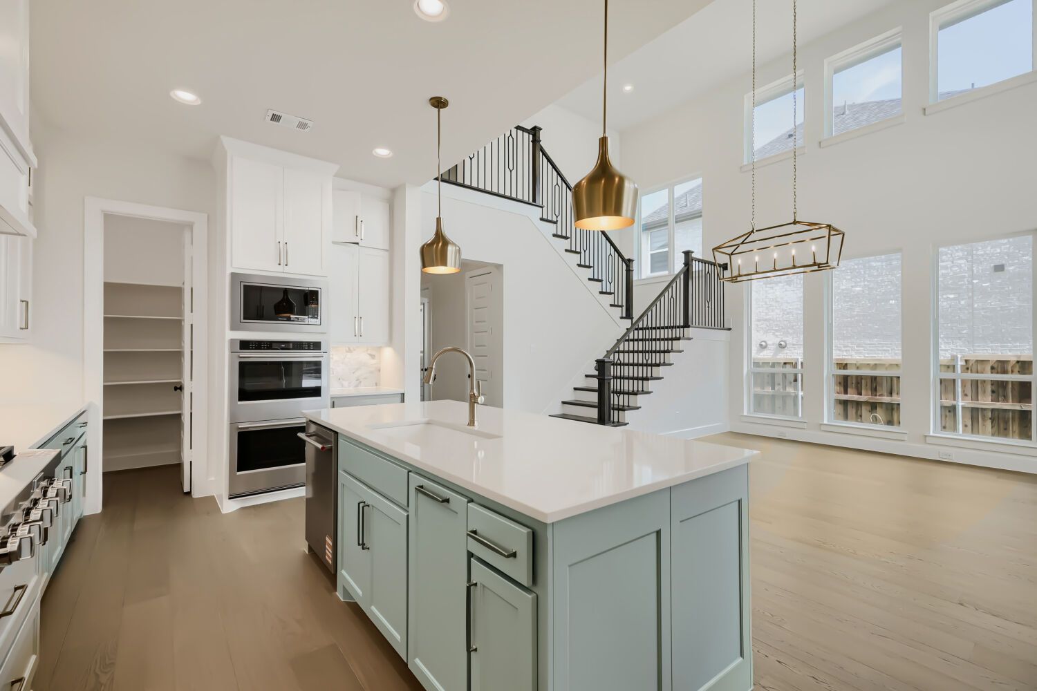 Plan 1543 Representative Photo - Kitchen and Staircase
