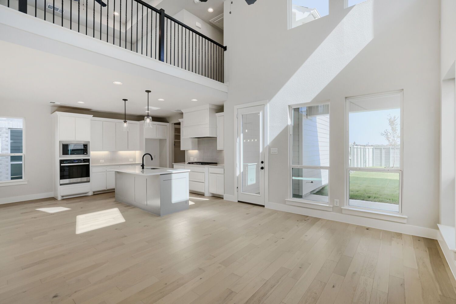 Plan 1604 Representative Photo of Open Concept | Living Area, Dining Area, Kitchen