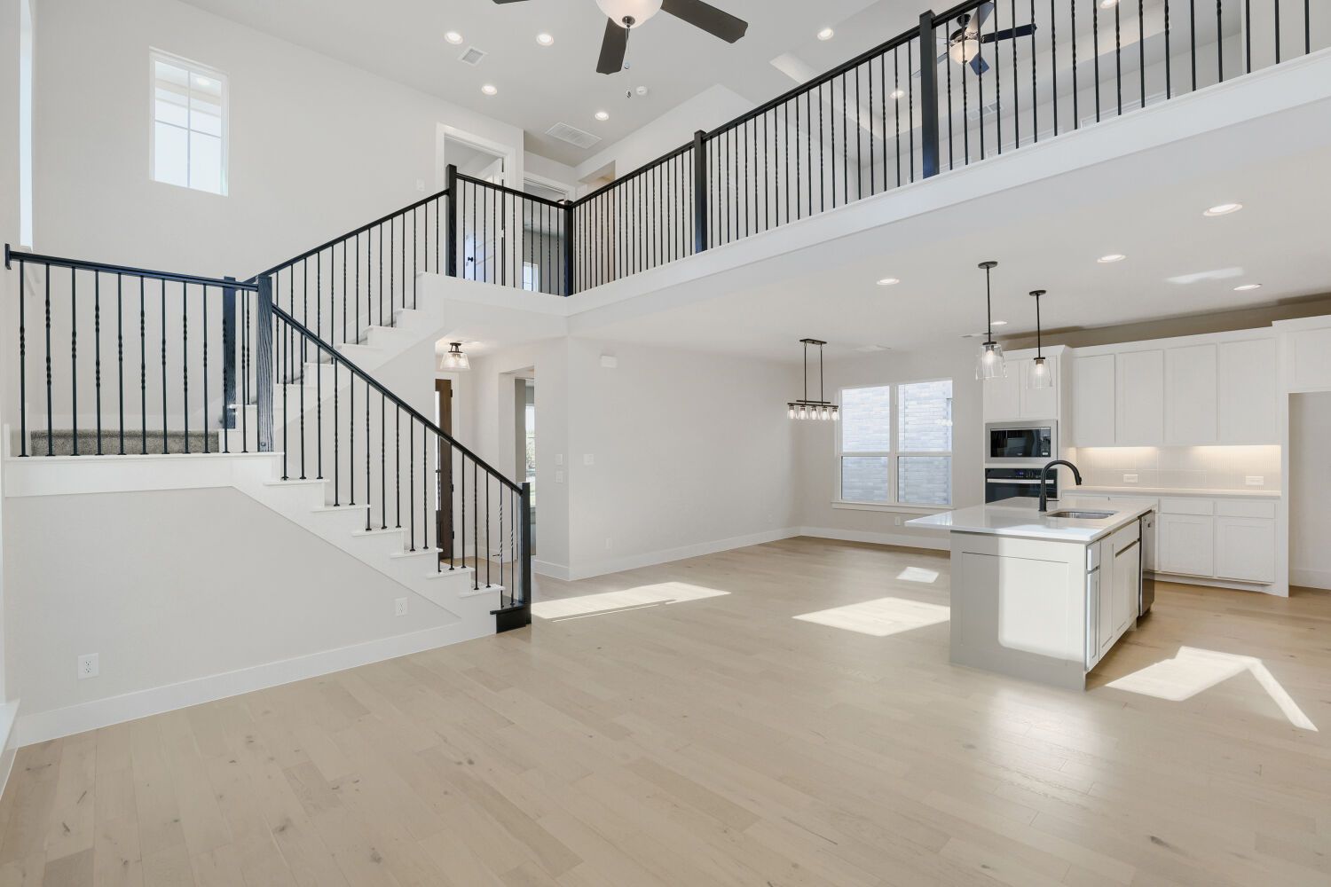 Plan 1604 Representative Photo of Staircase, Kitchen, Dining