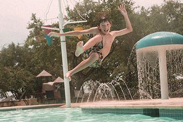 Wildridge Kid in Pool from American Legend Homes