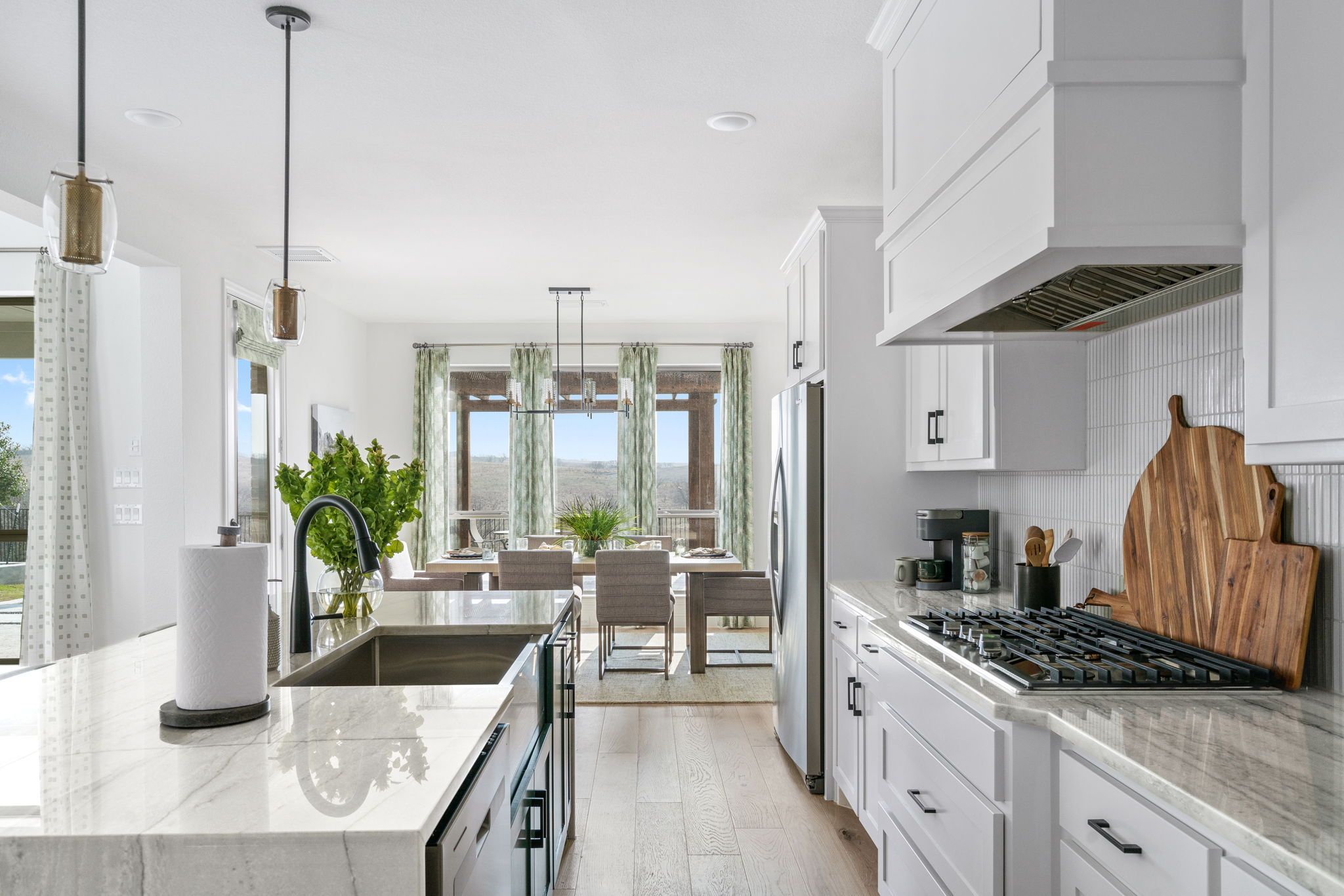 Plan 1686 Kitchen/Dining Room Photo by American Legend Homes