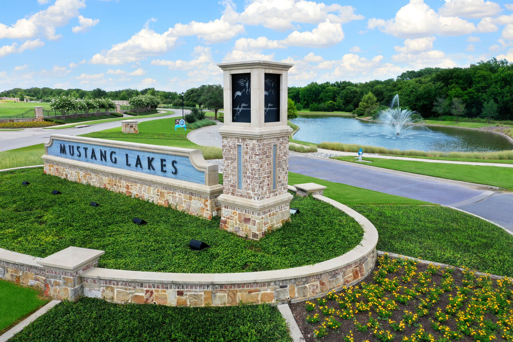 Mustang Lakes - Entry sign with pond in background
