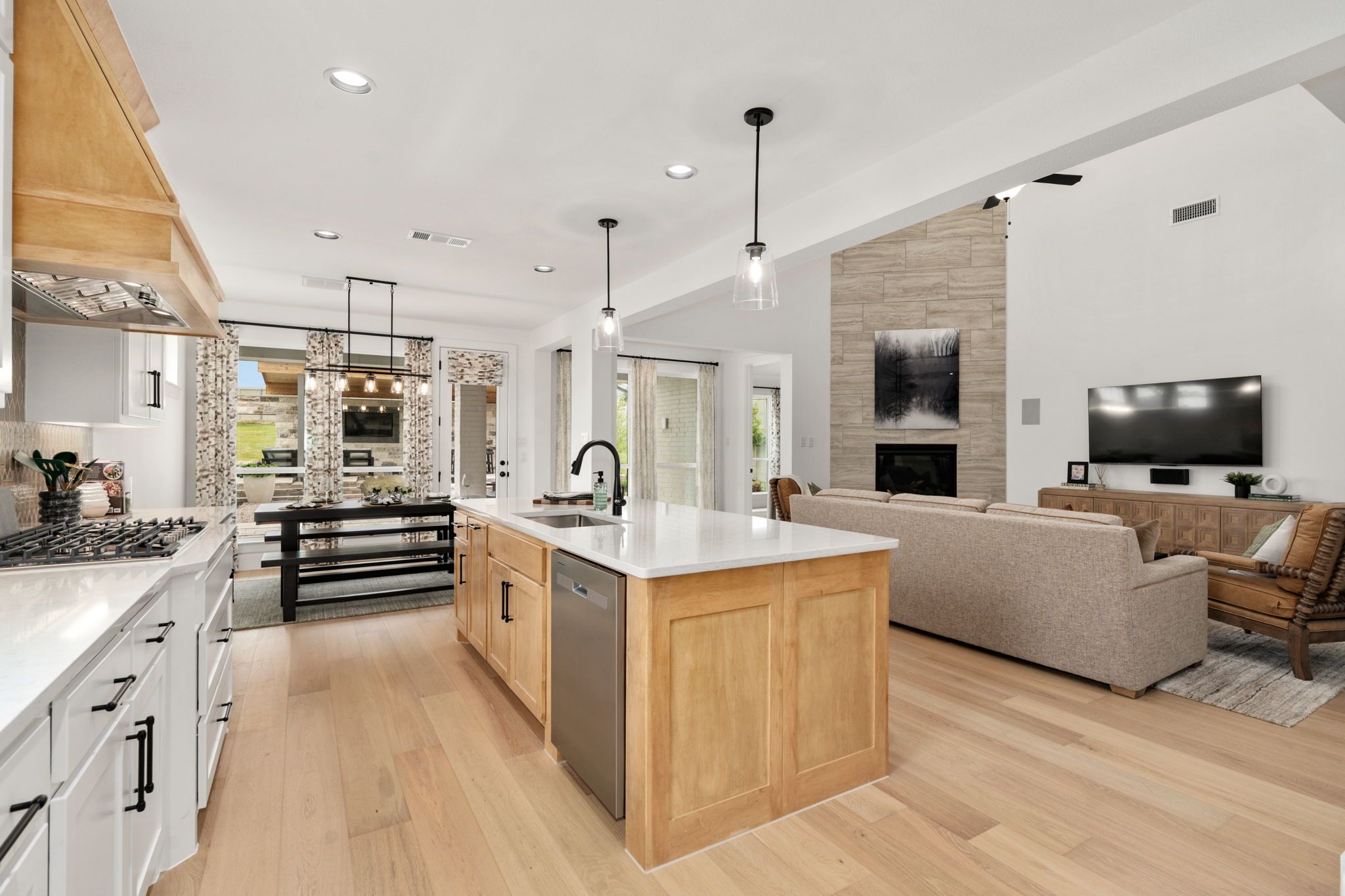 American Legend Homes' model in Treeline - Kitchen/Dining/Living Room