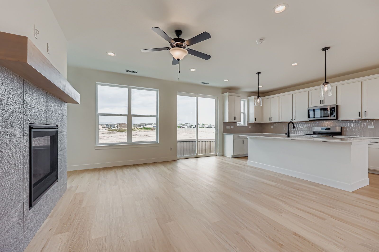 Plan C301 Representative Photo | Open-Concept Living Room with Fireplace