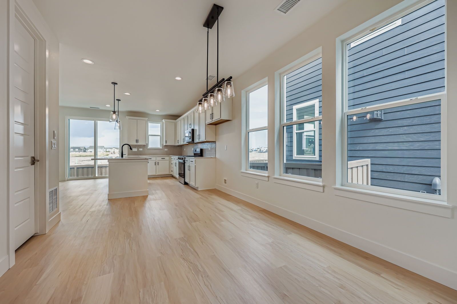 Plan C301 Representative Photo | Dining Area Connected to Kitchen
