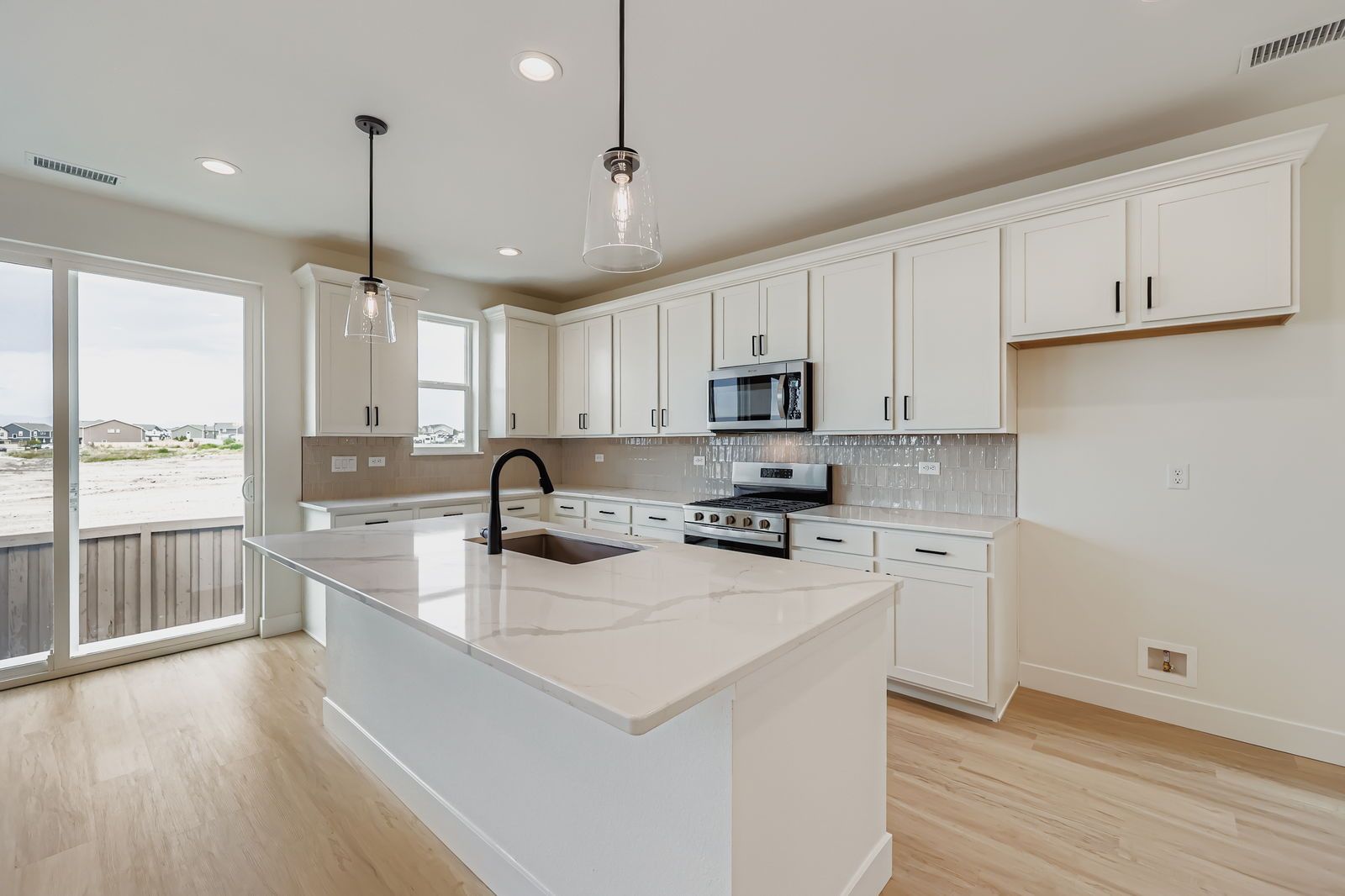 Plan C301 Representative Photo | Open Kitchen with Quartz Countertops