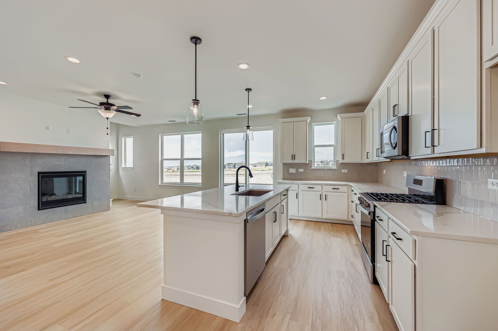 Plan C301 Representative Photo | Kitchen Overlooking Living Area