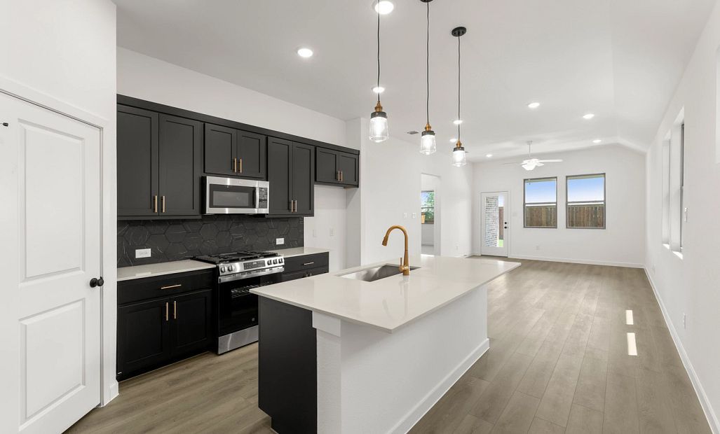 Open Kitchen-Living-Dining Room Representative Photo featuring the Noir Collection