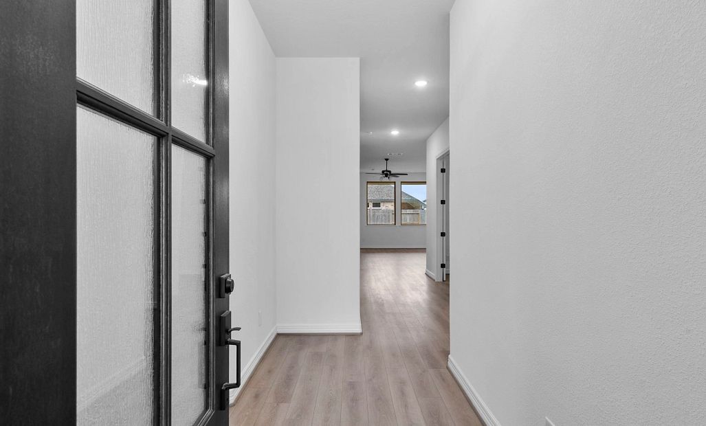 The home features a welcoming entry that flows naturally into the open living area.