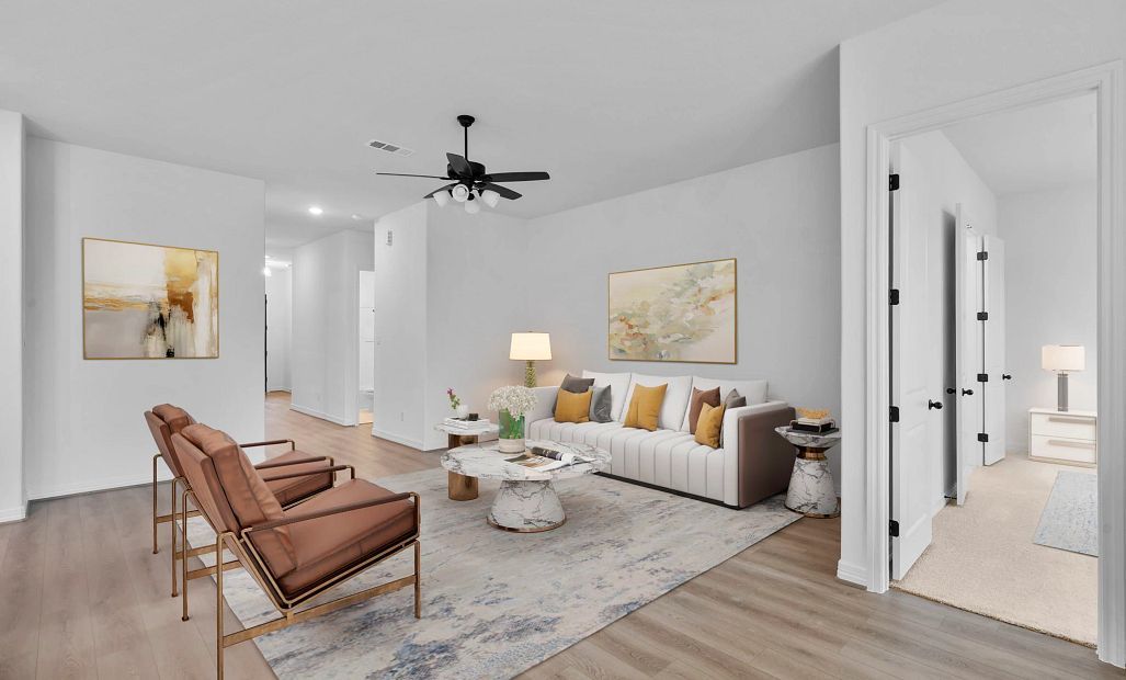 nviting living room featuring high ceilings, large windows, open to the kitchen for comfort and
