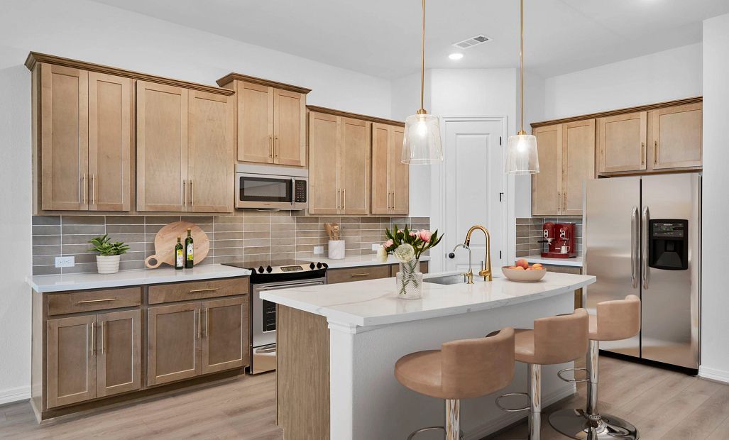 Kitchen featuring the AW Collection Laguna with warm stained cabinetry, light countertops, and a