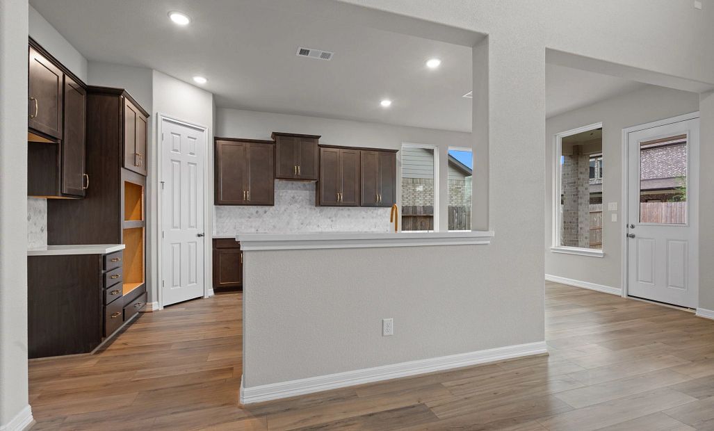 Modern kitchen overlooking the breakfast nook, ideal for morning coffee or quick meals.
