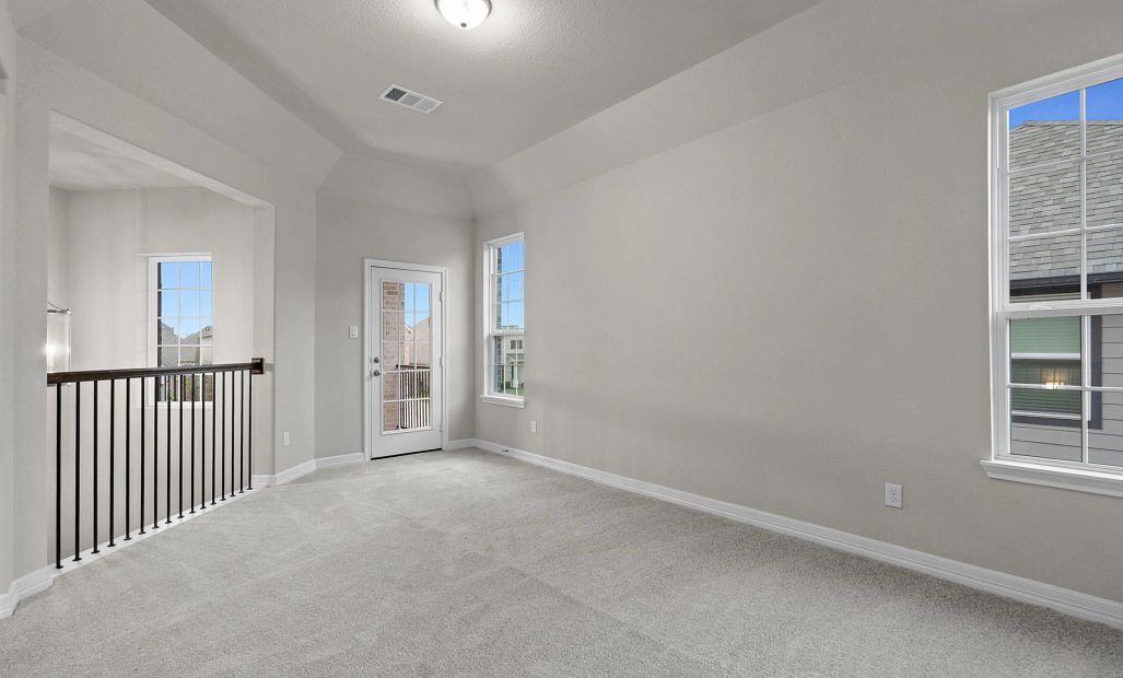 Bright upstairs game room with access to the patio, ideal for gatherings and outdoor enjoyment.