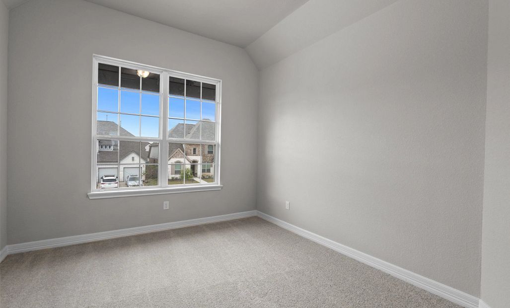 Fourth bedroom with a spacious walk-in closet and large windows—bright, comfortable, and versatile.