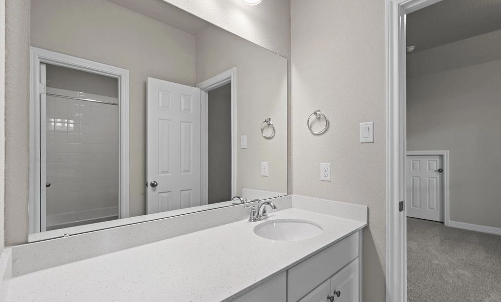 Jack and Jill bathroom with a large vanity—designed for convenience and family-friendly living.”