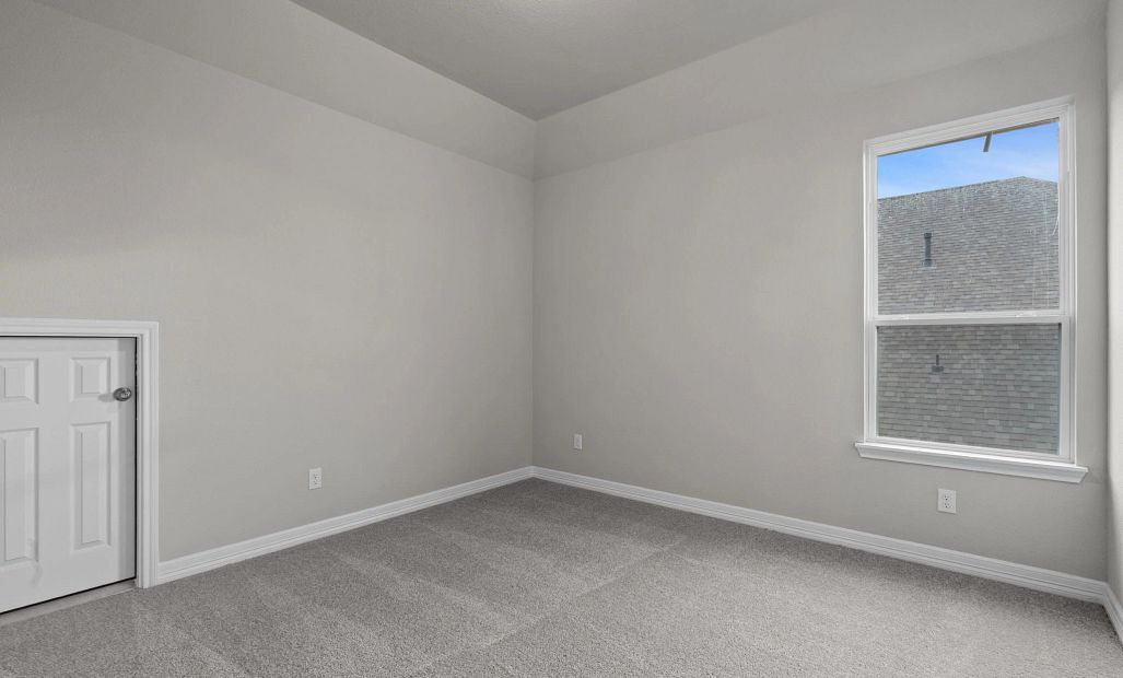 Inviting third bedroom with large window, closet, and easy connection to the Jack and Jill bath.