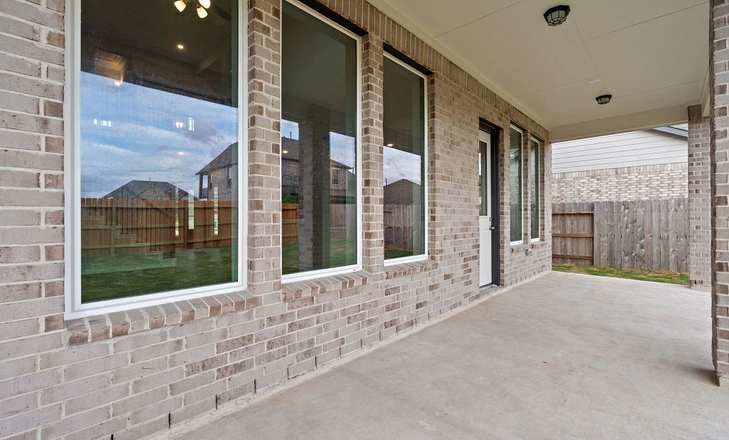 Oversized covered patio—perfect for outdoor dining, relaxing with family, or entertaining friends